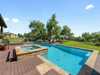 THE EPITOME OF HILL COUNTRY LIVING IN COVETED BELVEDERE