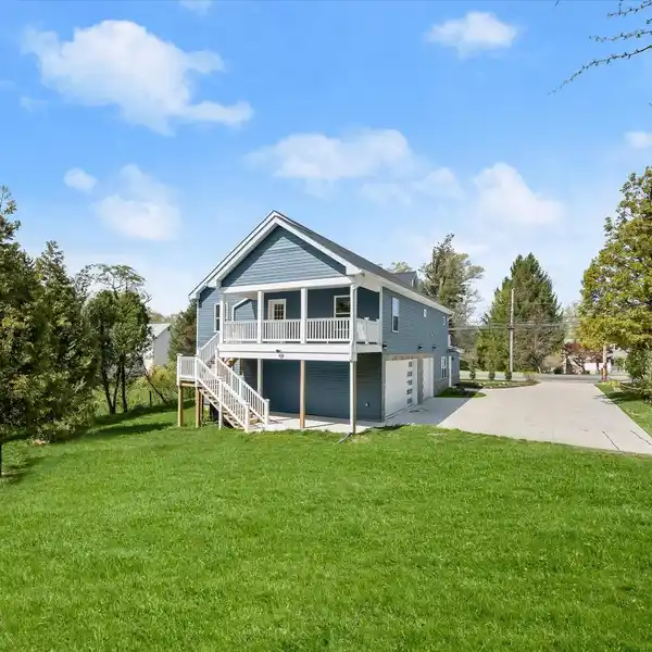 EXCEPTIONAL CONTEMPORARY COLONIAL ON A SERENE HALF-ACRE