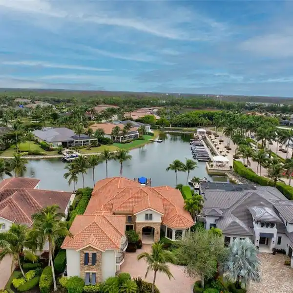 EXCEPTIONAL WATERFRONT ESTATE IN MIROMAR LAKES BEACH & GOLF CLUB