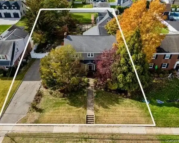 CLASSICALLY DESIGNED COLONIAL REVIVAL HOME WITH GRAND HISTORIC CHARM