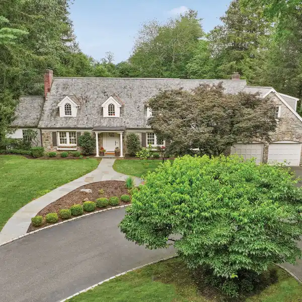 BEAUTIFULLY MAINTAINED 1945 STONE-FRONT CAPE