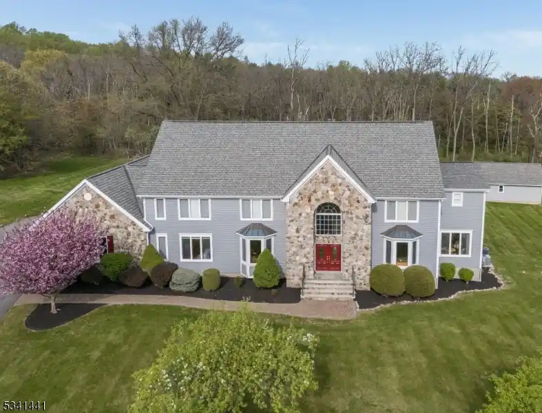 Elegant Colonial Retreat on Private Wooded Acreage