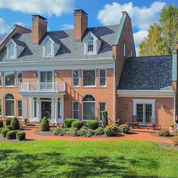 ENCHANTING ALL-BRICK COLONIAL IN TRANQUIL SETTING