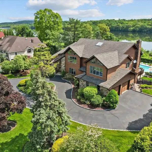 CONTEMPORARY COLONIAL OVERLOOKING SERENE LAKE DEFOREST