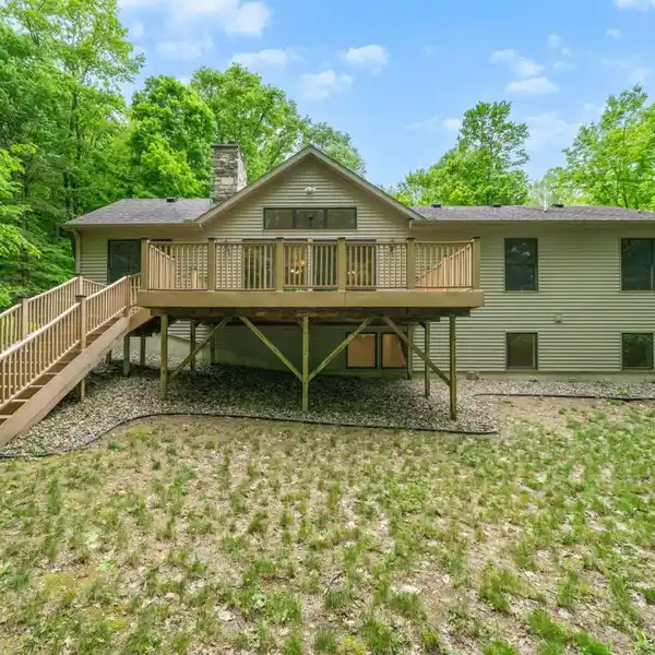 LAKEFRONT LIVING ON NEARLY 10 PRIVATE ACRES