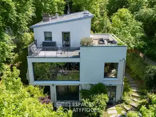 Elegant Glass-Roofed House with Garden Views