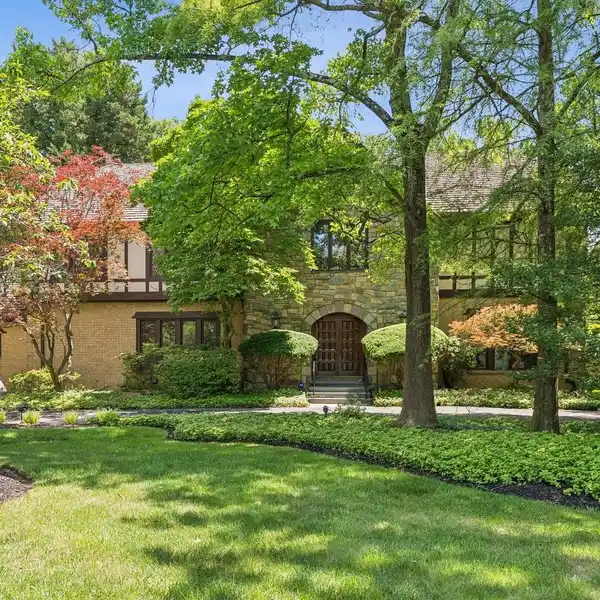 CUSTOM-BUILT BRICK AND STONE TUDOR
