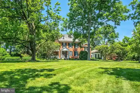 Manor House with Paneled Library and Sunroom