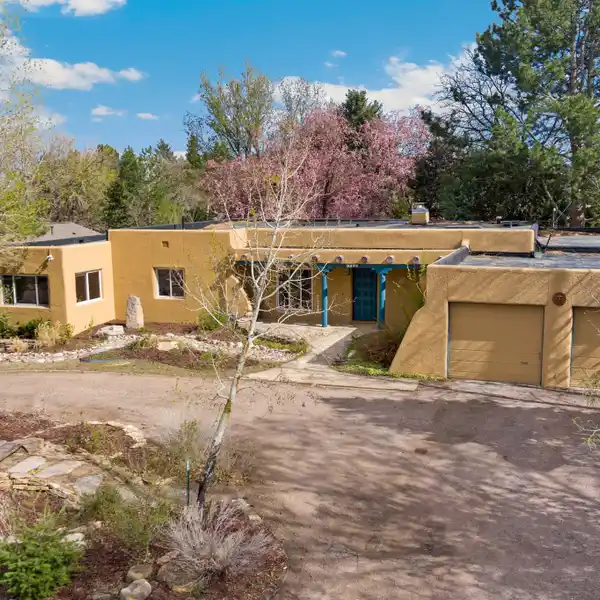 CLASSIC PUEBLO REVIVAL CHARM MEETS MODERN COMFORT!