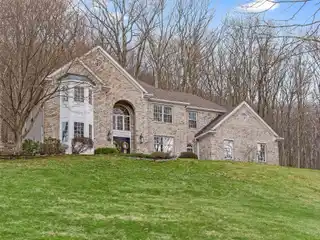Center Hall Colonial on Three Wooded Acres