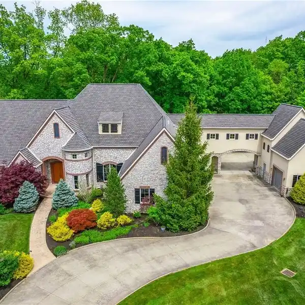 CUSTOM DESIGNED FRENCH CHATEAU HOME IN PICTURESQUE SETTING