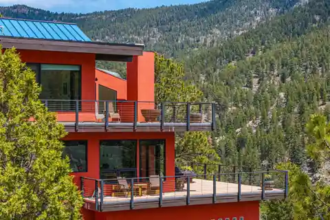 Eco-modern Escape with Forest, Stream, and Pond