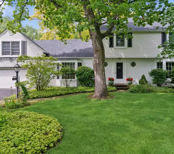 EXPANDED WHISPERING OAKS HOME ON A MATURE LOT