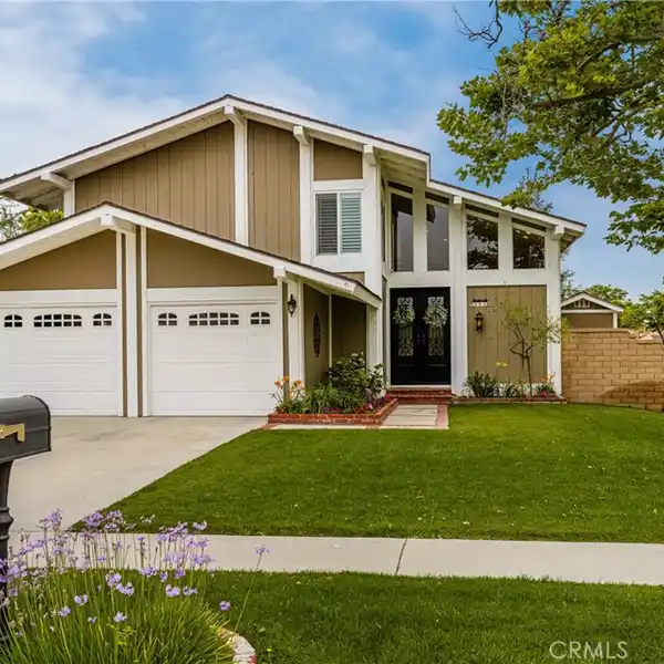 BEAUTIFULLY MAINTAINED HOME ON A PRIME CORNER LOT