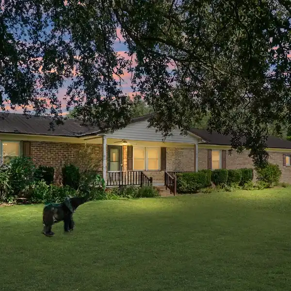 EXPANSIVE ONE-STORY ESTATE WITH CREEK, POND, AND WORKSHOP