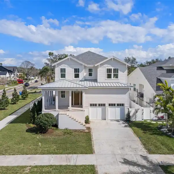 DELIGHTFUL NEW HOME ON A PRIME SNELL ISLAND CORNER LOT