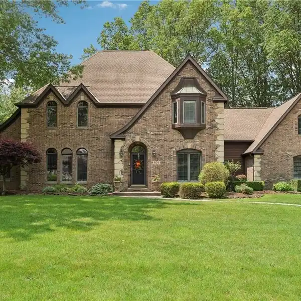 GRAND TUDOR STYLE WITH HEATED THREE-CAR GARAGE