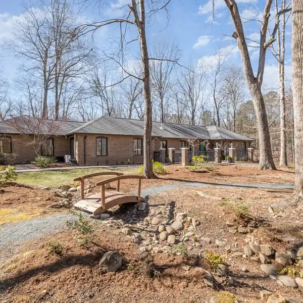 BEAUTIFUL BRICK TRADITIONAL HOME ON OVER AN ACRE IN THE HEART OF CHAPEL HILL