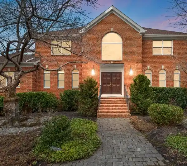 ELEGANT BRICK-FRONT COLONIAL IN SOUGHT-AFTER RUNNING BROOK