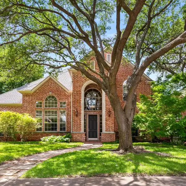 STUNNING HOME ON PICTURESQUE CORNER LOT