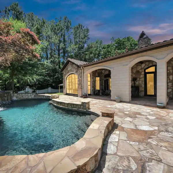 STUNNING SPANISH-STYLE HOME WITH PRIVATE THEATER AND CUSTOM-DESIGNED POOL
