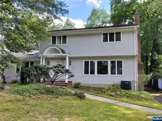 Well-Kept Center Hall Colonial Situated in a Prime Location