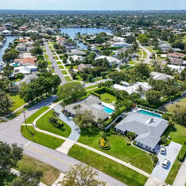 COUNTRY CLUB LIVING ON A PRIME CORNER LOT