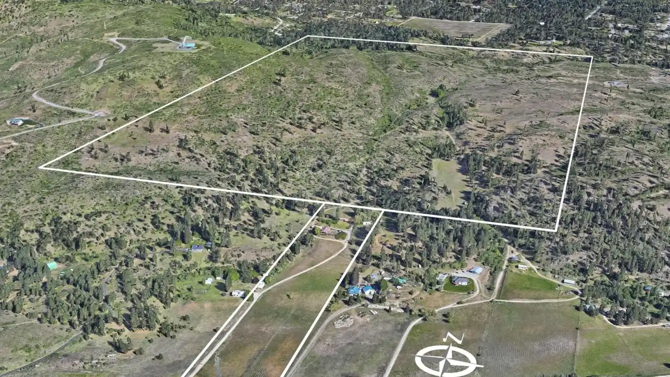 Huge Acreage with Farmhouse and Multiple Outbuildings