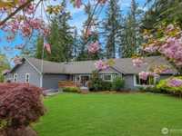 BEAUTIFULLY UPDATED HOME ON THREE PRIVATE ACRES