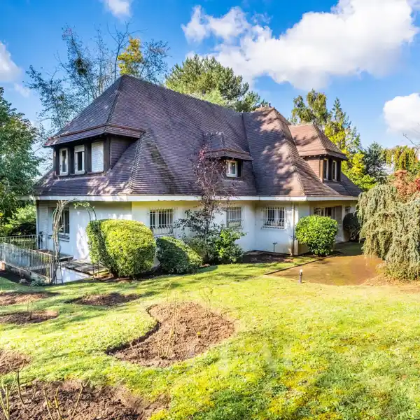 OPPORTUNITY TO RENOVATE A HOME IN A LUSH SETTING