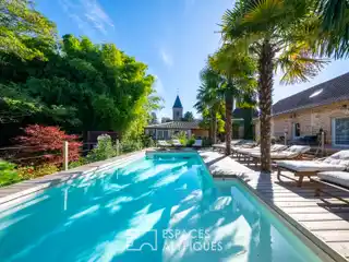 Idyllic Riverside Estate with Global-Inspired Serenity