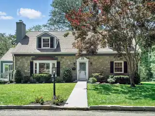 Meticulously Maintained and Turn-Key Cape Cod Style Residence