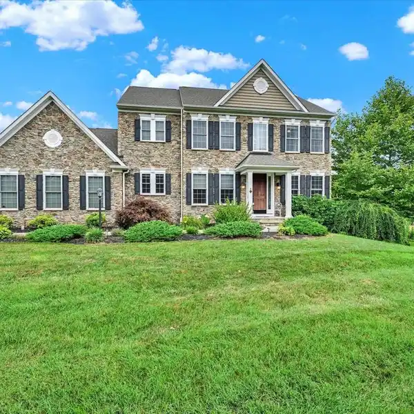 STUNNING STONE COLONIAL WITH OPEN-CONCEPT LIVING