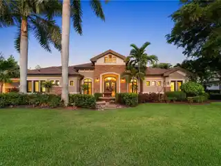 Grand Covered Portico with Dual Garages