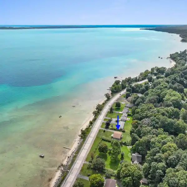 BEAUTIFULLY STYLED RETREAT WITH 100 FEET OF PRIVATE SANDY FRONTAGE