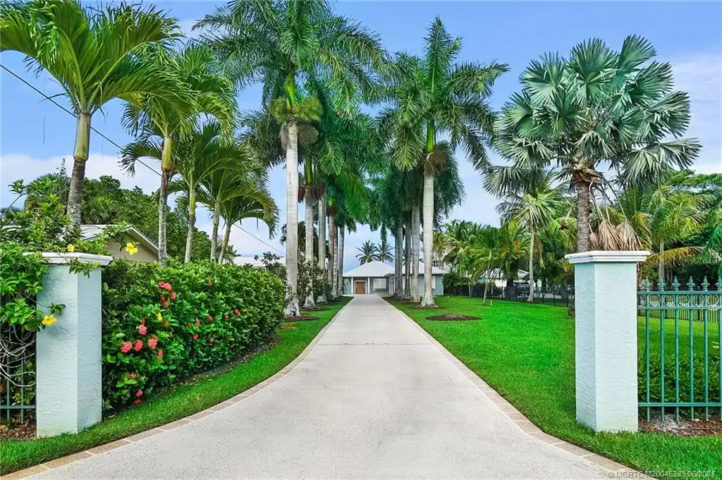 Water Front Pool Home Located in Prestigious Palm City