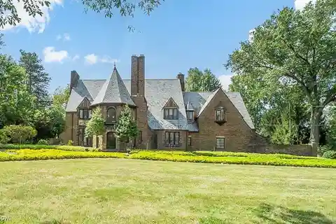 Classic 1920s Tudor with Creekside Landscaping