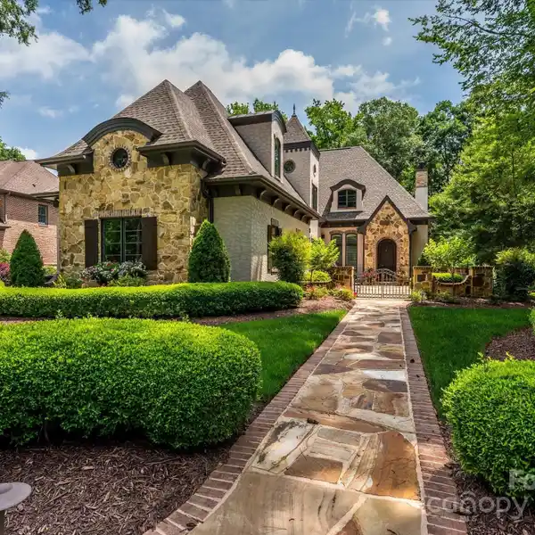 PRIVATE WOODED LOT WITH OUTDOOR LIVING, PATIO AND COVERED TERRACE