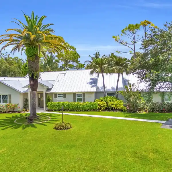 TROPICAL POOLSIDE LIVING ON EXPANSIVE ACREAGE