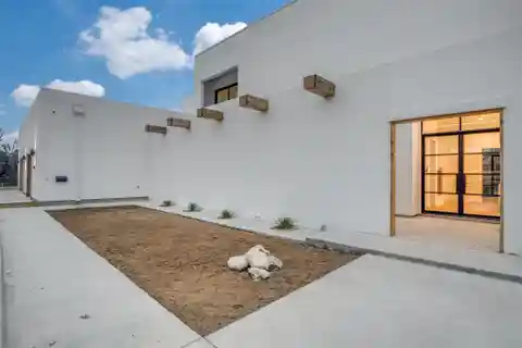 Modern Spanish Mission Estate on a Creek Lot