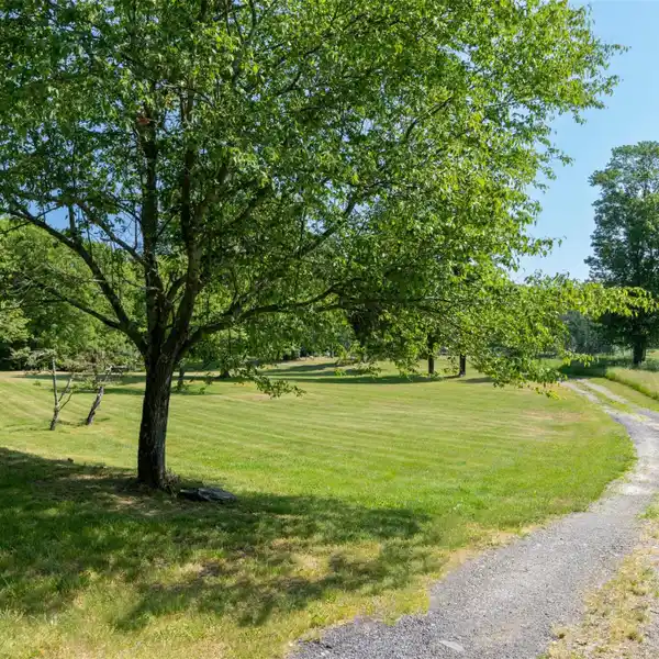CEDAR-SIDED TRADITIONAL HOME ON 23 ACRES