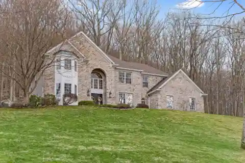 Center Hall Colonial on Three Wooded Acres