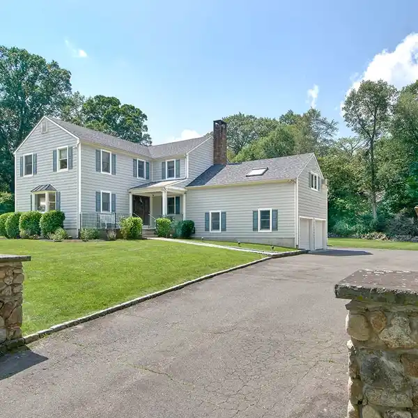 UNIQUE COLONIAL HOME ON A LEVEL CORNER LOT