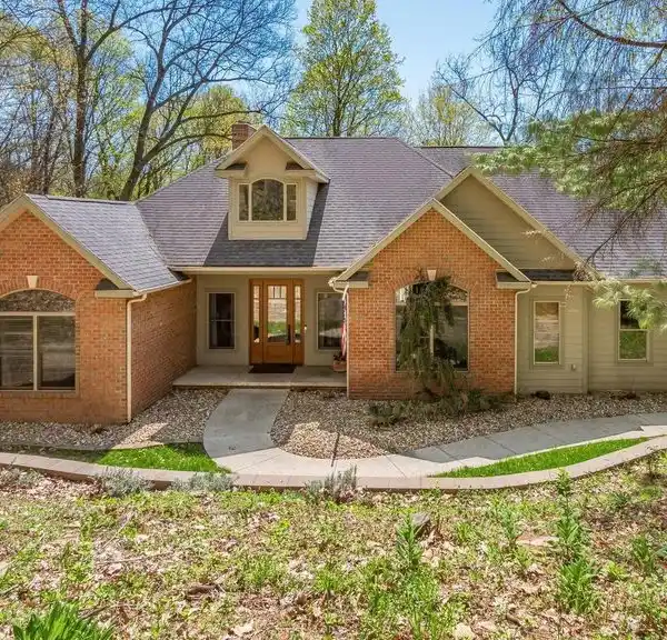 CUSTOM RANCH HOME ON A PRIVATE WOODED LOT