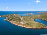 EXCLUSIVE LAKEFRONT PRIVATE ESTATE WITH PRIVATE SANDY BEACH