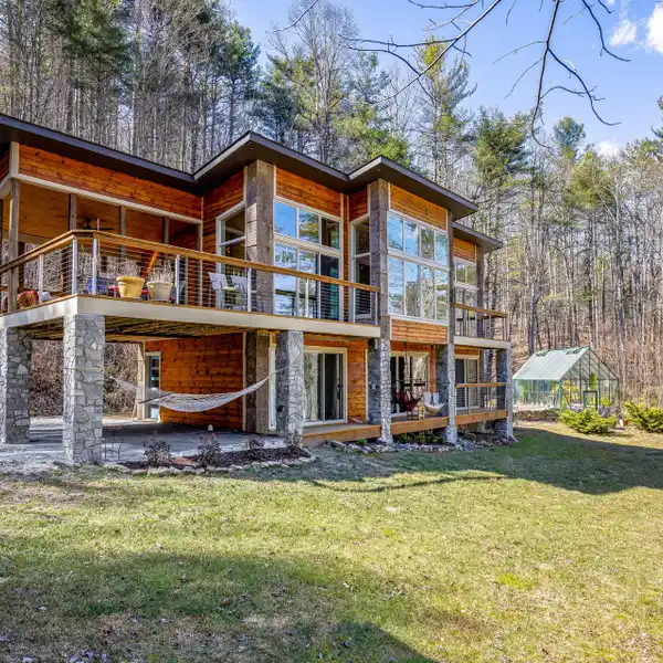 CONTEMPORARY RETREAT ON 20-PLUS ACRES