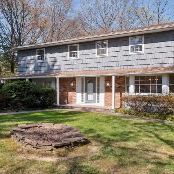 CENTER HALL COLONIAL ON OVER AN ACRE