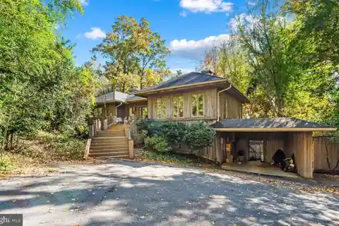 Curved Cabinetry and Marble Floors Throughout