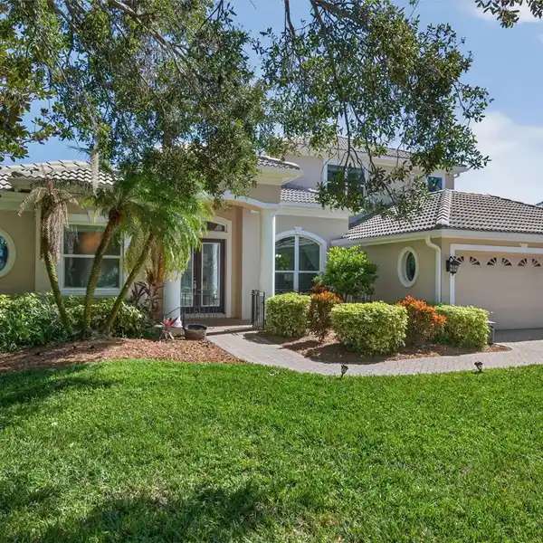 ELEGANT LAKEFRONT LIVING IN GATED SERENITY