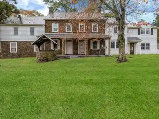 Brick Fireplace Anchors Formal Living Room
